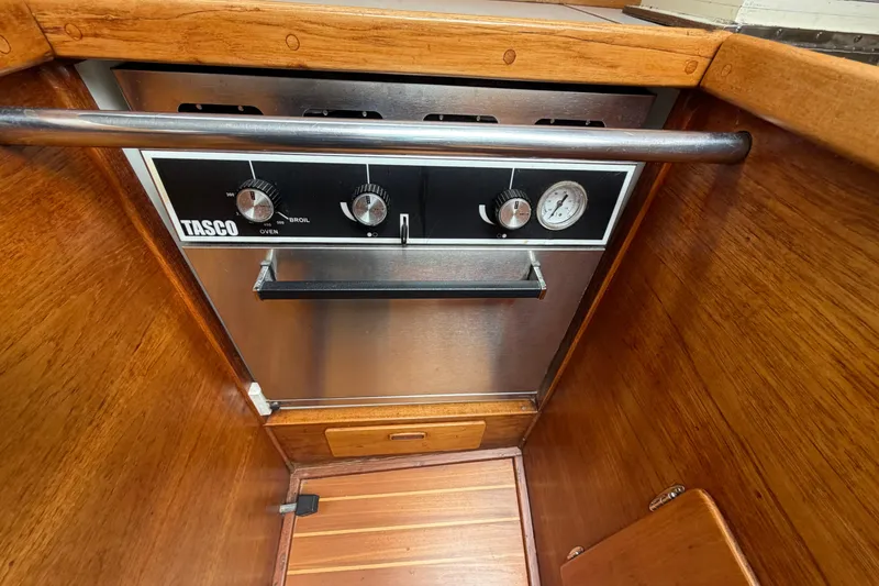 Slide: The Image of Vintage Tasco oven in a 1982 Sabre 34 yacht's wooden interior galley. - 11