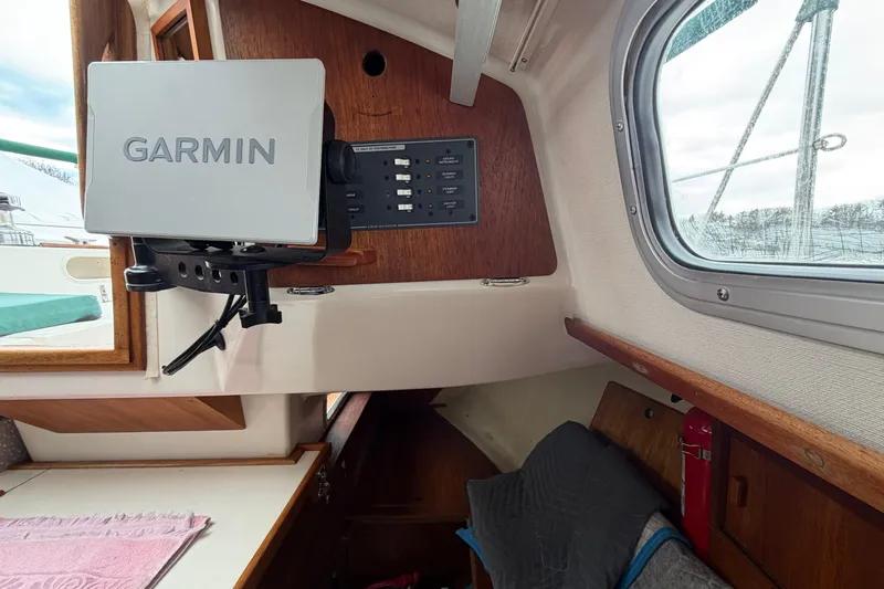 Slide: The Image of Interior of a 1982 Sabre 34 sailboat featuring a Garmin navigation system. - 13