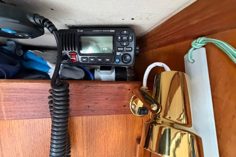 Slide: The Image of VHF marine radio and brass lamp inside 1982 Sabre 34 sailboat cabin. - 15