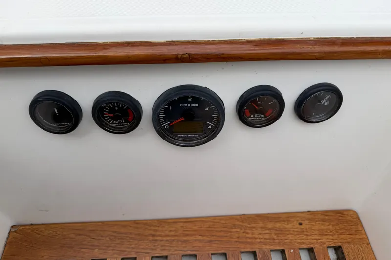 Slide: The Image of Control panel of a 1982 Sabre 34 sailboat with gauges and wooden trim. - 18