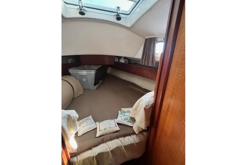 Slide: The Image of Cozy cabin interior of 1982 Sabre 34 sailboat with bedding and storage. - 21