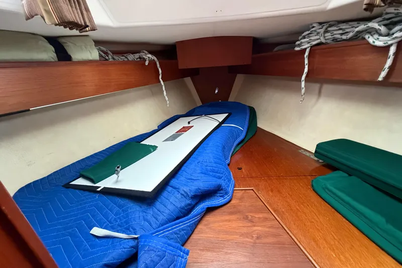 Slide: The Image of Interior cabin of a 1982 Sabre 34 sailboat with wooden finishes and storage. - 22