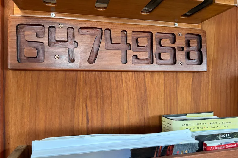 Slide: The Image of Wooden plaque with number 647496-8 on a 1982 Sabre 34 sailboat interior. - 26