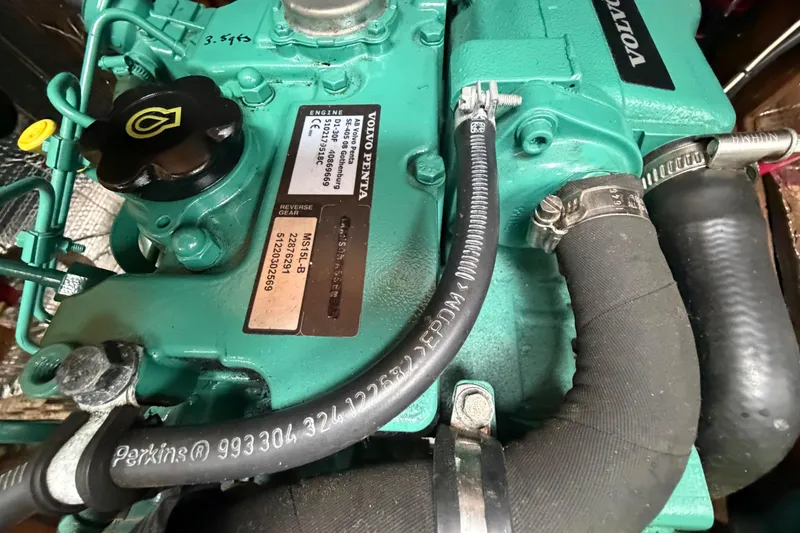 Slide: The Image of Volvo Penta engine in a 1982 Sabre 34 sailboat, showcasing detailed components and labels. - 32
