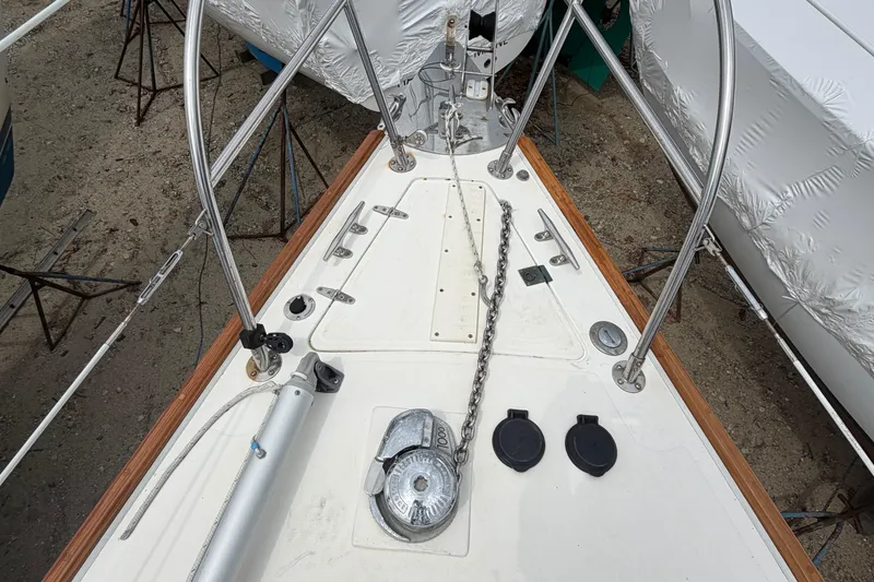 Slide: The Image of Bow of 1982 Sabre 34 sailboat with anchor chain and deck fittings. - 36