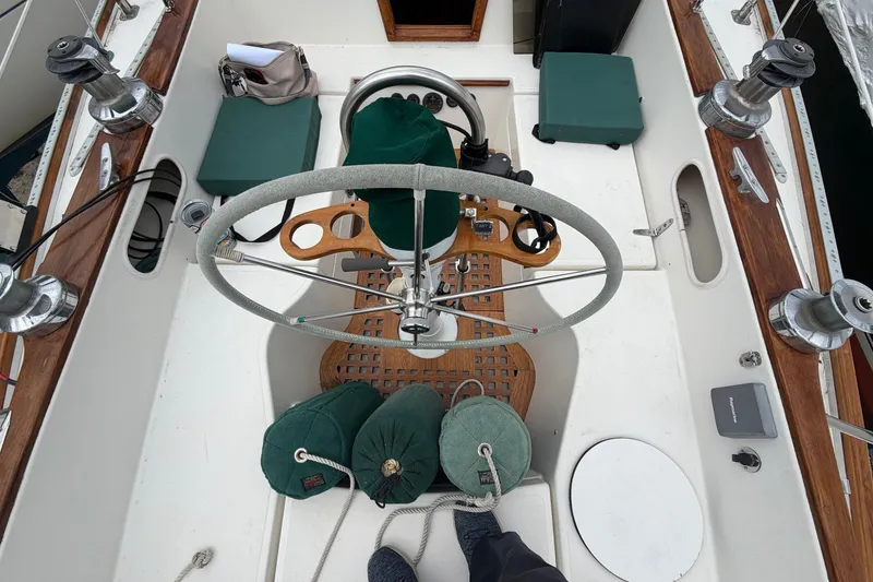 Slide: The Image of Cockpit of 1982 Sabre 34 sailboat with steering wheel and winches. - 39