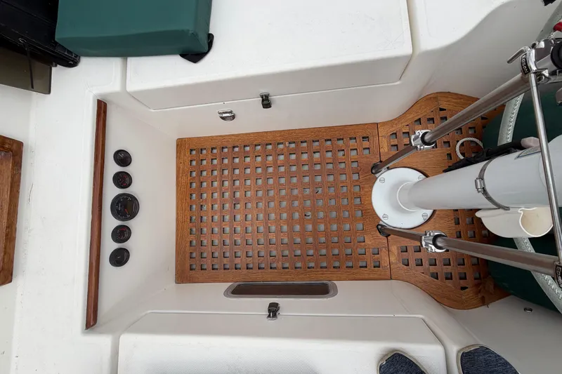 Slide: The Image of Cockpit of 1982 Sabre 34 sailboat with wooden flooring and instrument panel. - 48