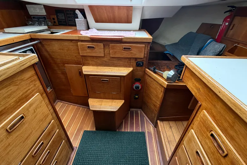 Slide: The Image of Interior of 1982 Sabre 34 sailboat with wooden cabinetry and compact layout. - 7