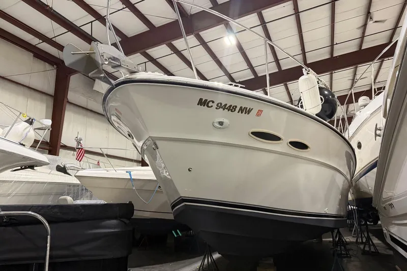 Slide: The Image of 1989 Sea Ray 390 Express Cruiser in indoor storage facility. - 12