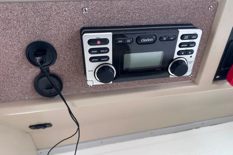 Slide: The Image of Clarion audio system on 1989 Sea Ray 390 Express Cruiser dashboard. - 17