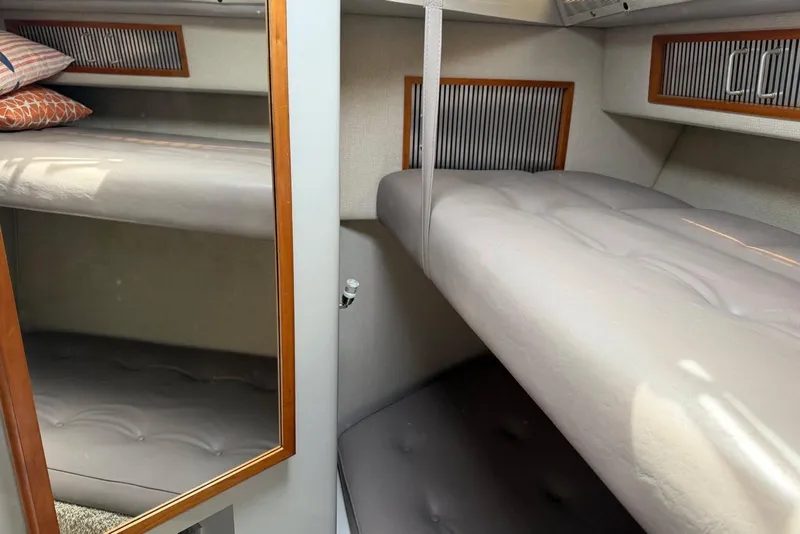 Slide: The Image of Interior cabin of 1989 Sea Ray 390 Express Cruiser with bunk beds. - 42