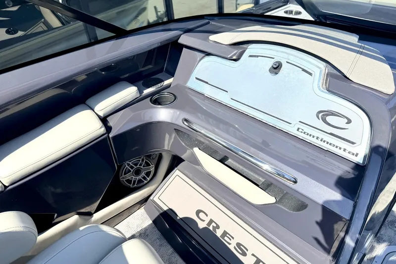 Slide: The Image of Interior of 2022 Crest Continental 270 NX-CS Twin boat, featuring sleek design and comfortable seating. - 12