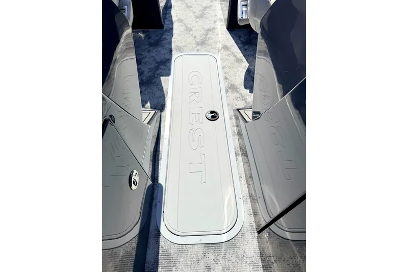 Slide: The Image of 2022 Crest Continental 270 NX-CS Twin boat deck with embossed logo. - 14