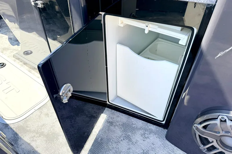 Slide: The Image of Open storage compartment on 2022 Crest Continental 270 NX-CS Twin boat. - 17