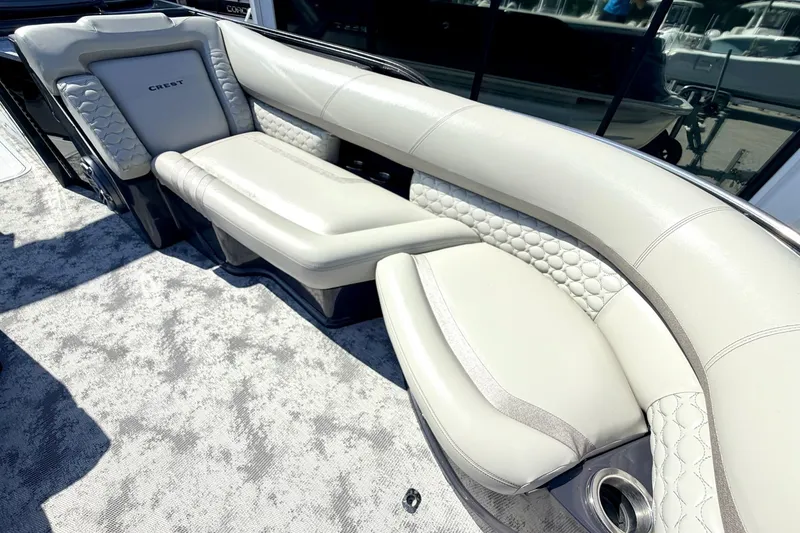 Slide: The Image of Luxurious seating on 2022 Crest Continental 270 NX-CS Twin boat, featuring elegant upholstery design. - 21