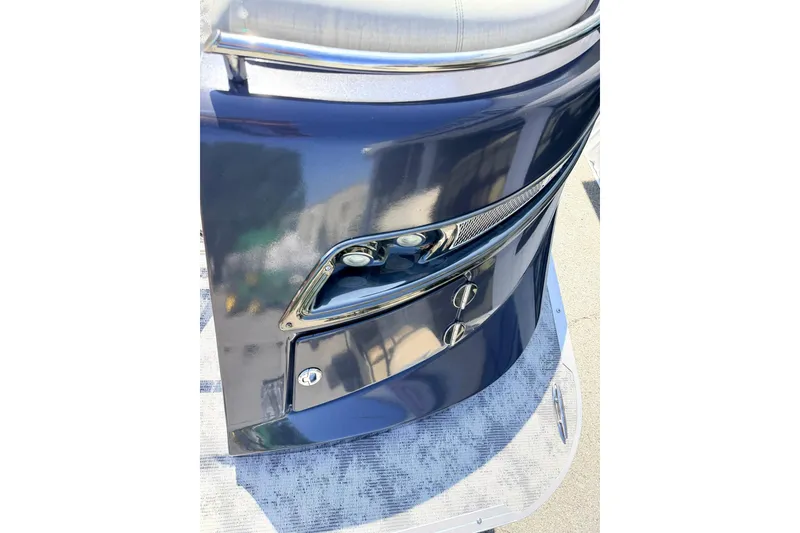 Slide: The Image of 2022 Crest Continental 270 NX-CS Twin boat, sleek blue exterior with chrome accents. - 24