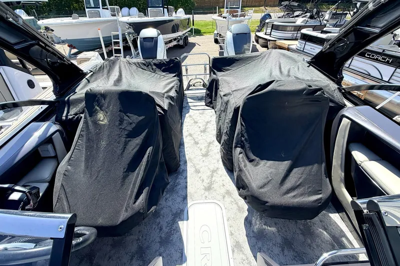 Slide: The Image of 2022 Crest Continental 270 NX-CS Twin boat interior with covered seating and modern design. - 26