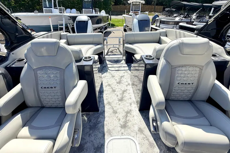 Slide: The Image of Luxurious interior of 2022 Crest Continental 270 NX-CS Twin pontoon boat with plush seating. - 8