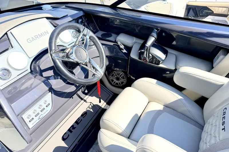 Slide: The Image of Luxurious 2022 Crest Continental 270 NX-CS Twin boat interior with Garmin navigation system. - 9