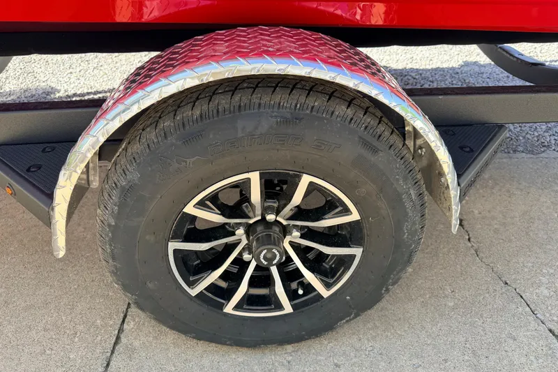 Slide: The Image of Trailer wheel of 2026 Crestliner 1650 Kodiak WT with diamond plate fender. - 10