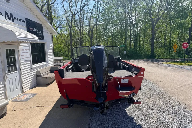 Slide: The Image of 2026 Crestliner 1650 Kodiak WT boat parked outside a marine shop. - 3