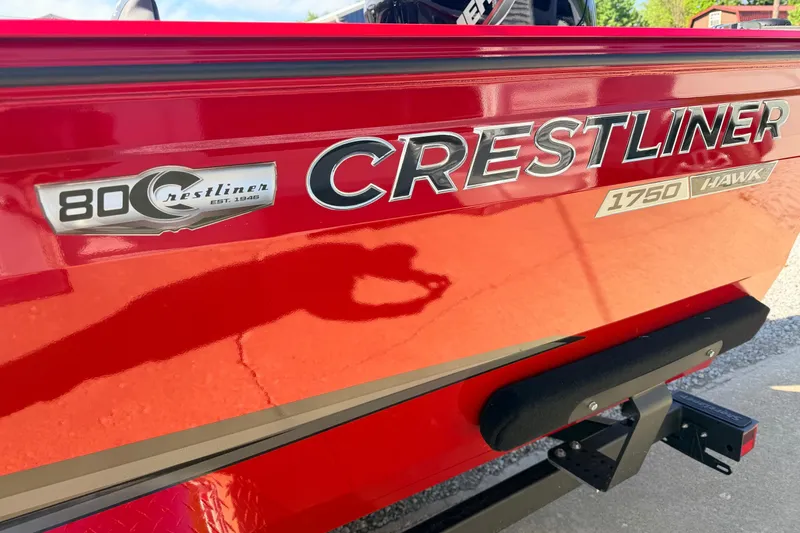 Slide: The Image of Red Crestliner 1750 Hawk boat with 80th anniversary badge, side view. - 9