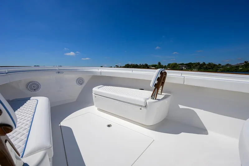 Slide: The Image of 2025 Valhalla Boatworks V-41 interior with white seating under clear blue sky. - 10