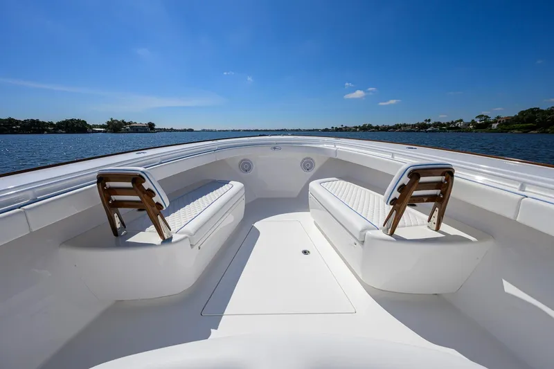 Slide: The Image of 2025 Valhalla Boatworks V-41, spacious deck with seating, on a sunny day by the water. - 13