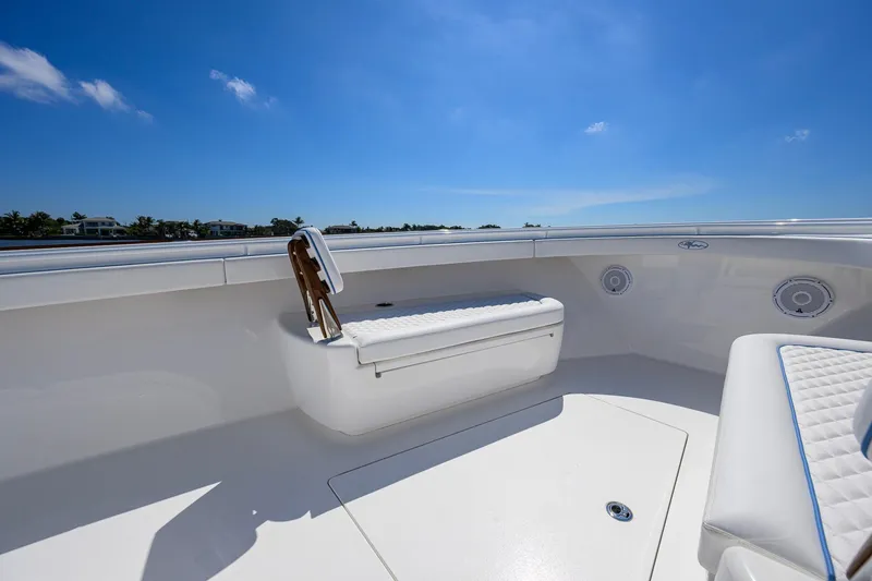 Slide: The Image of 2025 Valhalla Boatworks V-41 interior with white seating under clear blue sky. - 14