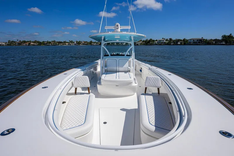 Slide: The Image of 2025 Valhalla Boatworks V-41 on calm water, showcasing sleek design and luxurious seating. - 16