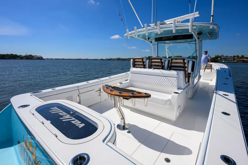 Slide: The Image of 2025 Valhalla Boatworks V-41 on water, featuring sleek design and spacious seating. - 25