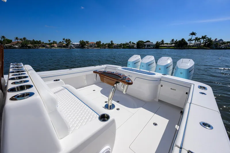 Slide: The Image of 2025 Valhalla Boatworks V-41 with quad engines, luxurious seating, and scenic waterfront view. - 28