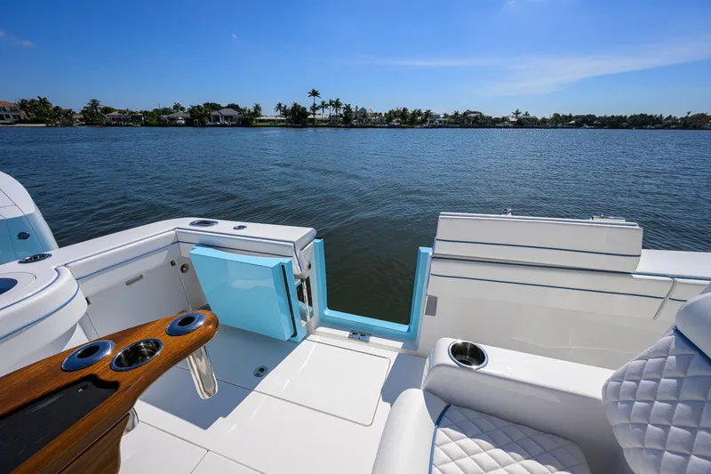 Slide: The Image of 2025 Valhalla Boatworks V-41 interior with luxurious seating and scenic water view. - 29