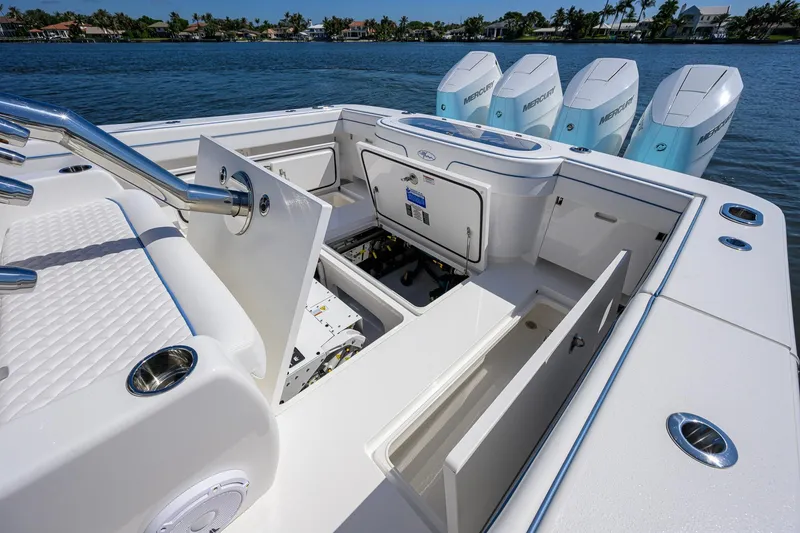 Slide: The Image of 2025 Valhalla Boatworks V-41 with open storage compartments and four Mercury engines. - 32