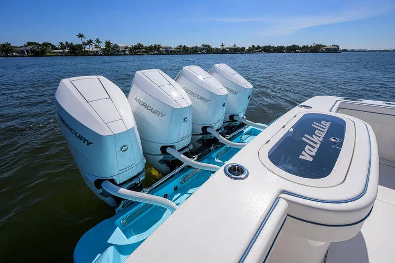 Slide: The Image of 2025 Valhalla Boatworks V-41 with four Mercury outboard engines on a sunny day. - 36