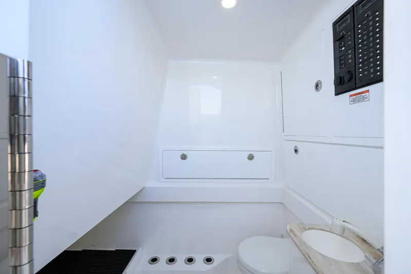 Slide: The Image of 2025 Valhalla Boatworks V-41 interior with modern bathroom and control panel. - 40