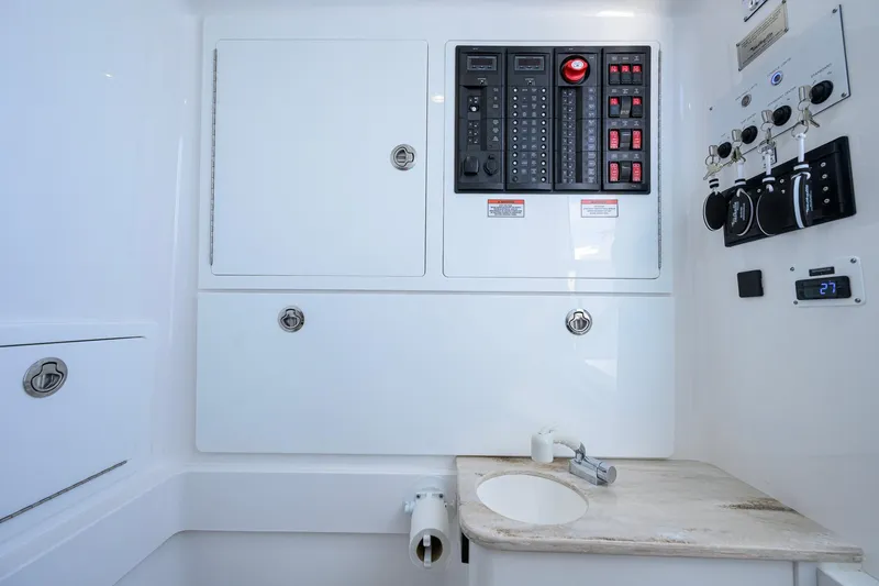Slide: The Image of 2025 Valhalla Boatworks V-41 interior control panel with sink and storage compartments. - 41