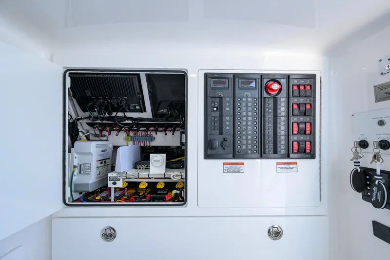 Slide: The Image of Electrical panel and wiring inside a 2025 Valhalla Boatworks V-41. - 42