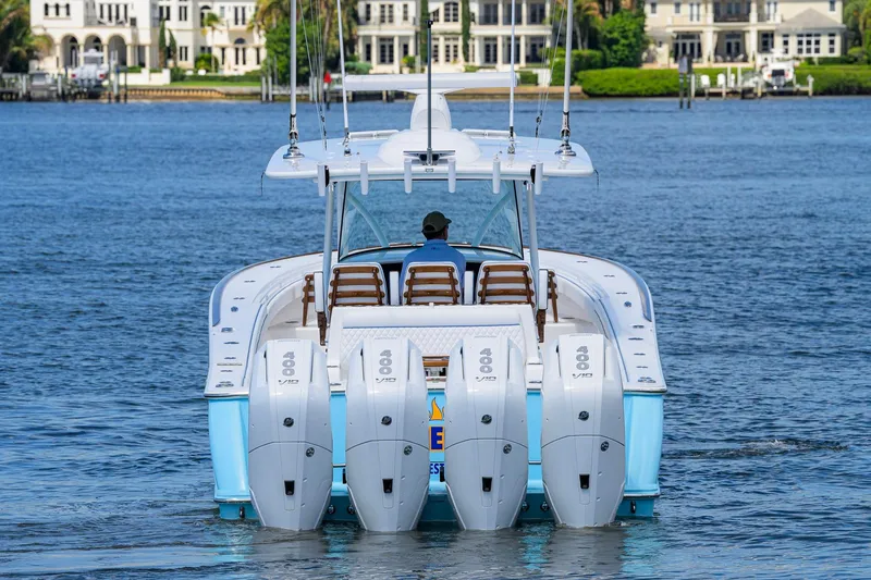 Slide: The Image of 2025 Valhalla Boatworks V-41 with quad engines cruising on a scenic waterway. - 5