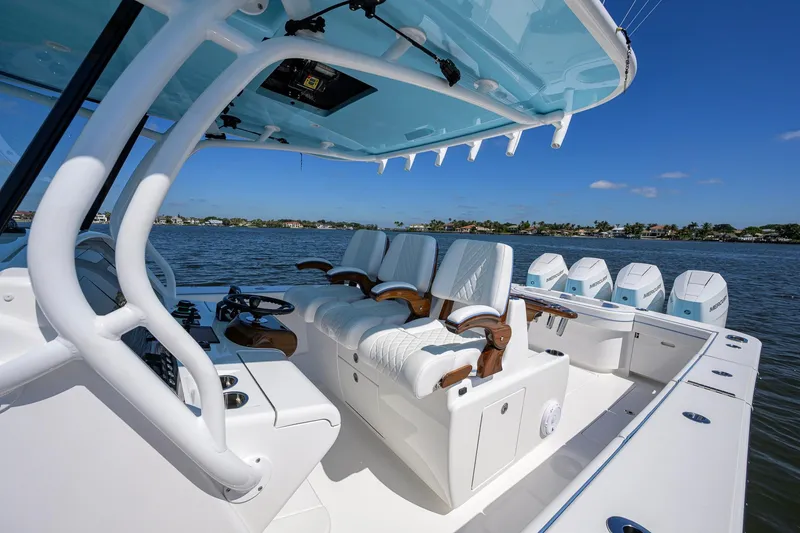 Slide: The Image of 2025 Valhalla Boatworks V-41 luxury boat interior with seating and multiple engines on a sunny day. - 8