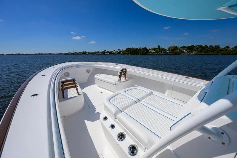 Slide: The Image of 2025 Valhalla Boatworks V-41 luxury deck with seating, cruising on a sunny day. - 9