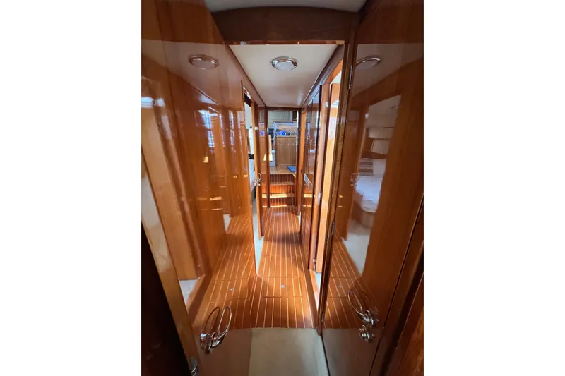 Slide: The Image of Luxurious wooden interior hallway of 2002 Riviera 54 Enclosed Flybridge yacht. - 18