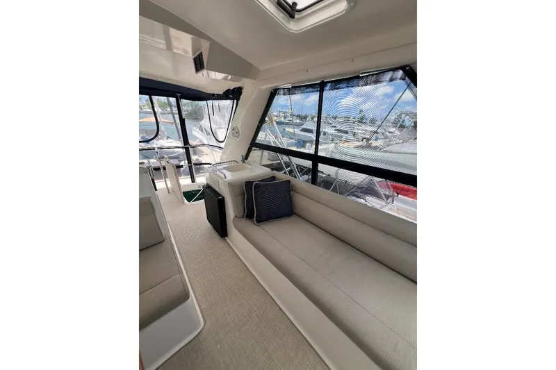 Slide: The Image of Interior of 2002 Riviera 54 Enclosed Flybridge with seating and large windows. - 31