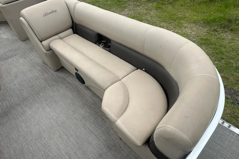 Slide: The Image of 2021 Bentley Pontoons 240 CRUISE beige seating with cup holders on a pontoon boat. - 10