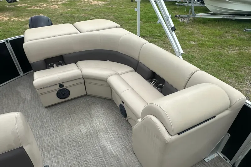 Slide: The Image of 2021 Bentley Pontoons 240 CRUISE interior with beige seating and cup holders. - 11