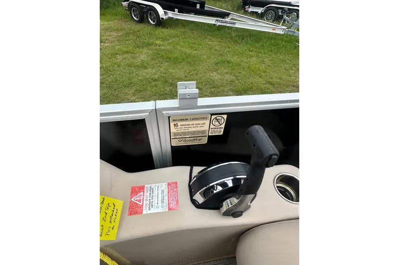 Slide: The Image of Control panel of a 2021 Bentley Pontoons 240 CRUISE with capacity warning label. - 13