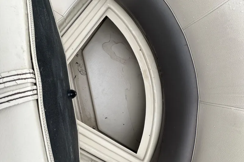 Slide: The Image of Interior view of a 2021 Bentley Pontoons 240 CRUISE boat seat and storage compartment. - 16