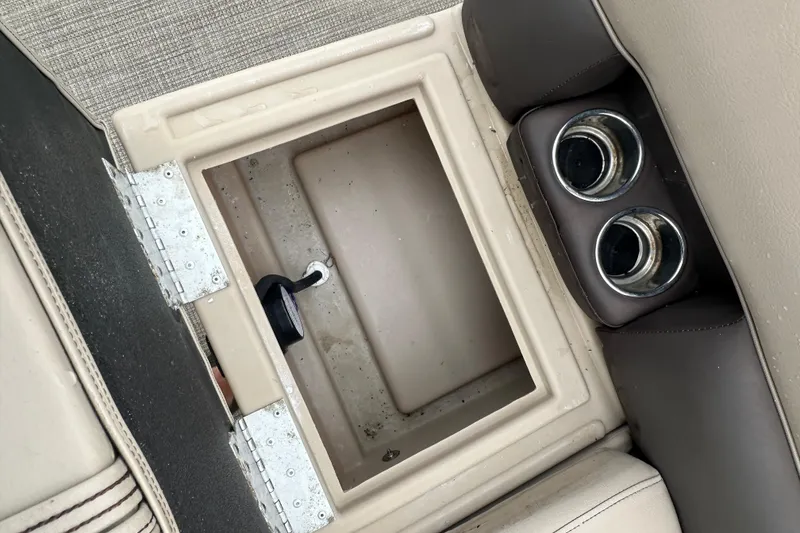 Slide: The Image of Open storage compartment with cup holders on a 2021 Bentley Pontoons 240 CRUISE. - 18