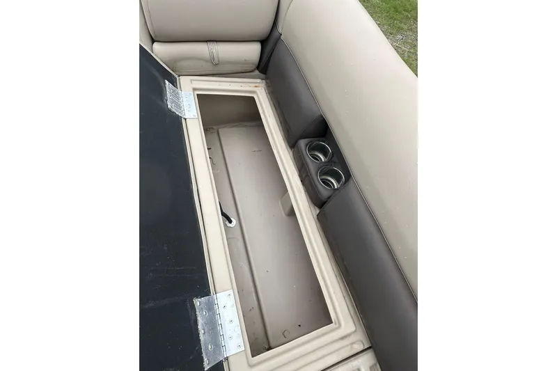 Slide: The Image of Open storage compartment with cup holders in a 2021 Bentley Pontoons 240 CRUISE. - 20