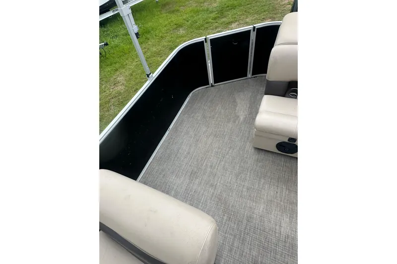 Slide: The Image of 2021 Bentley Pontoons 240 CRUISE interior with beige seating and gray flooring. - 22